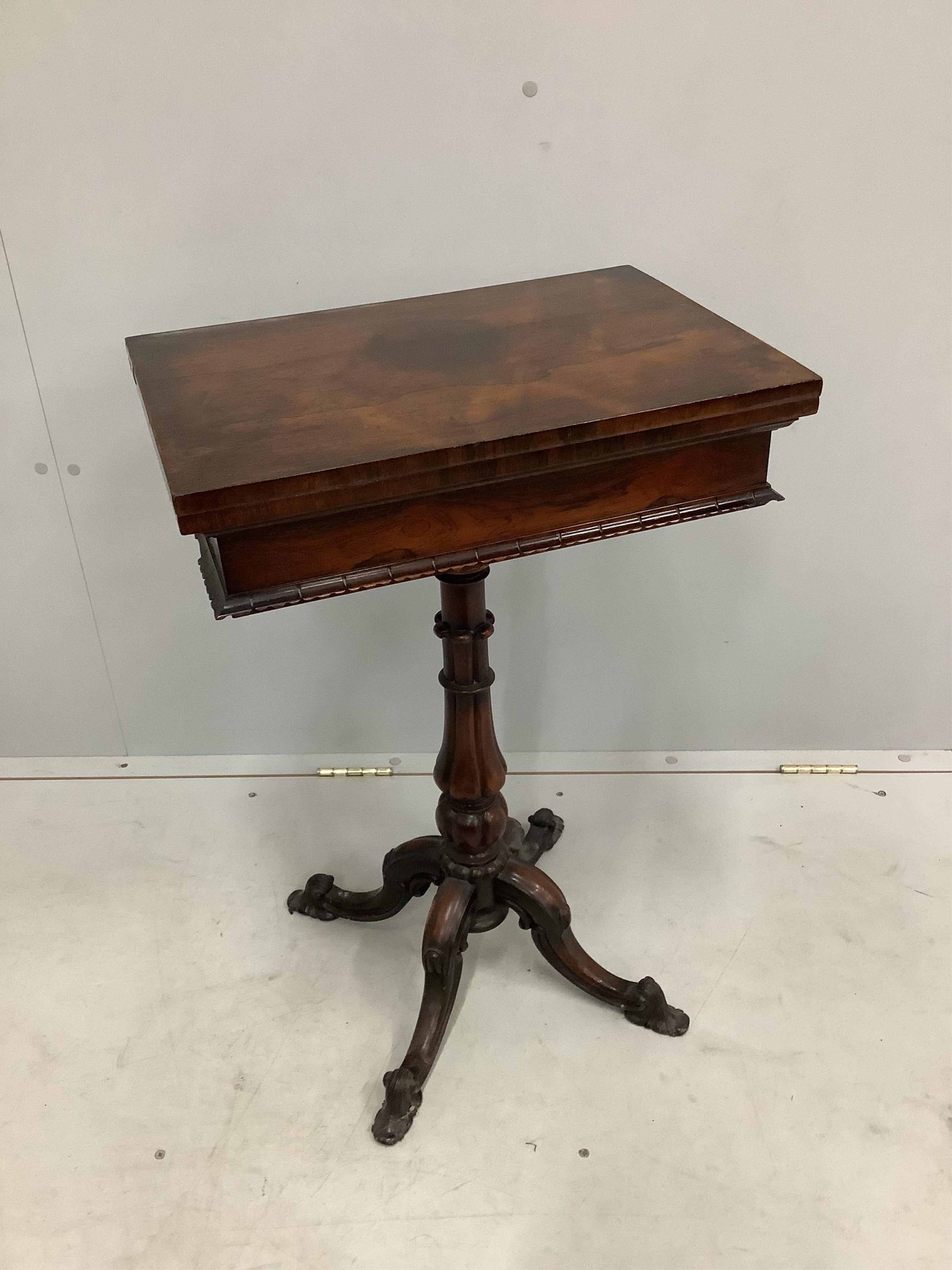 An early Victorian rectangular rosewood folding games table, width 50cm, depth 35cm, height 75cm
